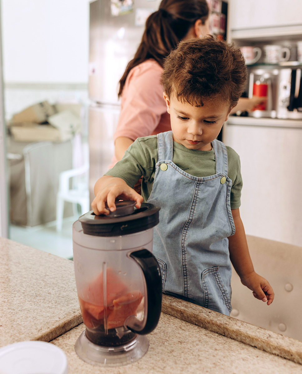 Kid making smoothies